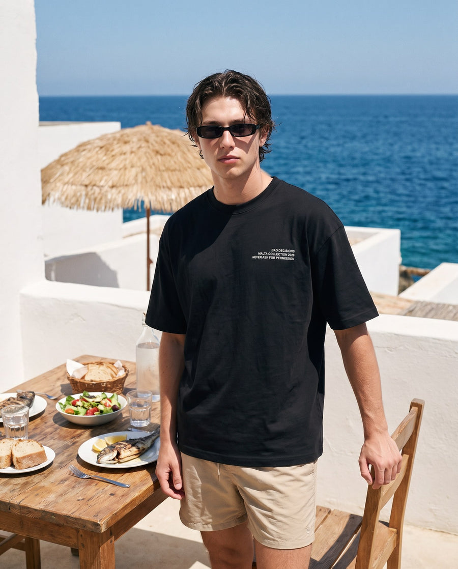 Camiseta oversized MALTA® bad decisions às 12h: volta da praia